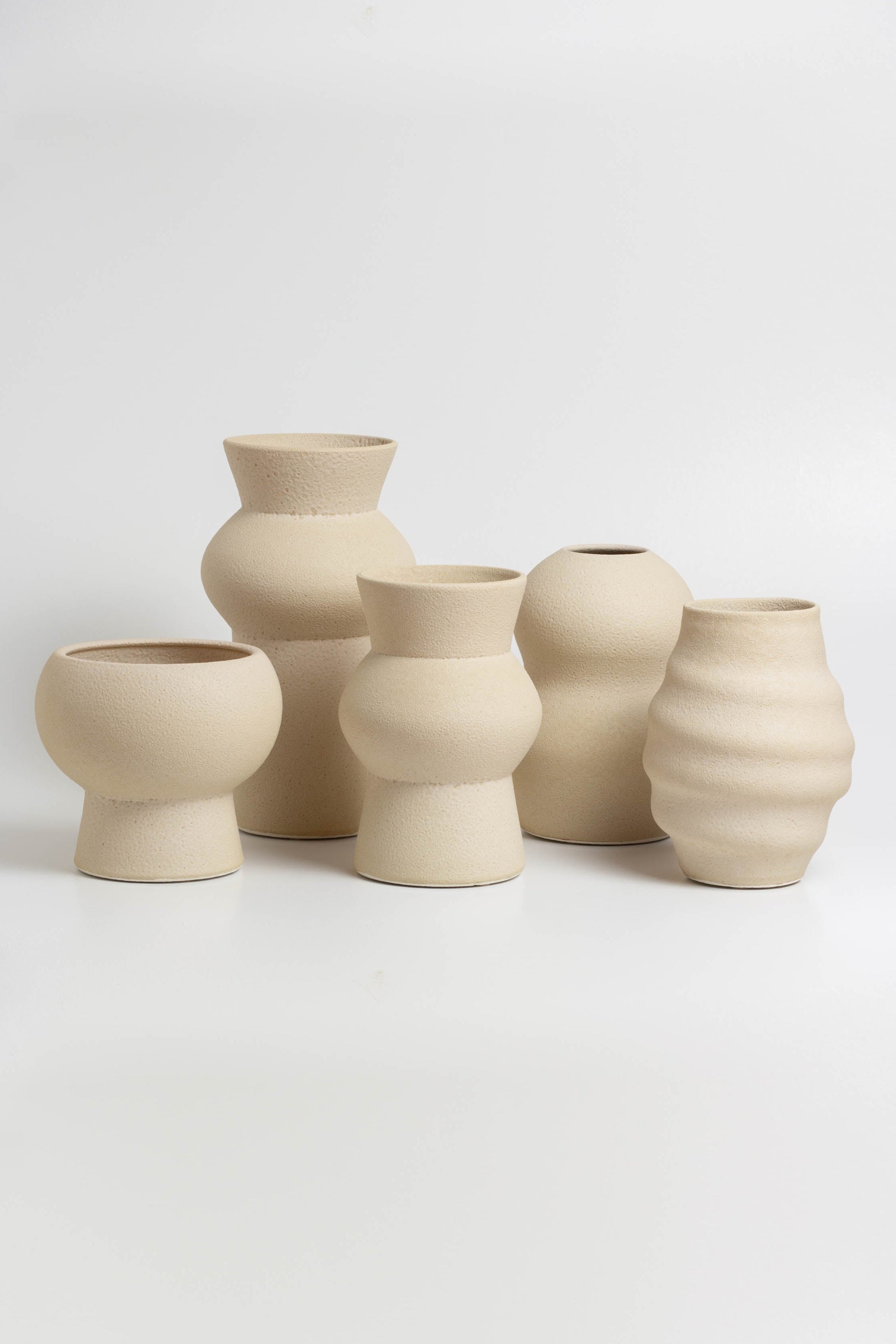 decorative vases in cream, minimalist design inspired by the beauty of volcanic textures. It's durable, sustainable and handmade in Portugal.