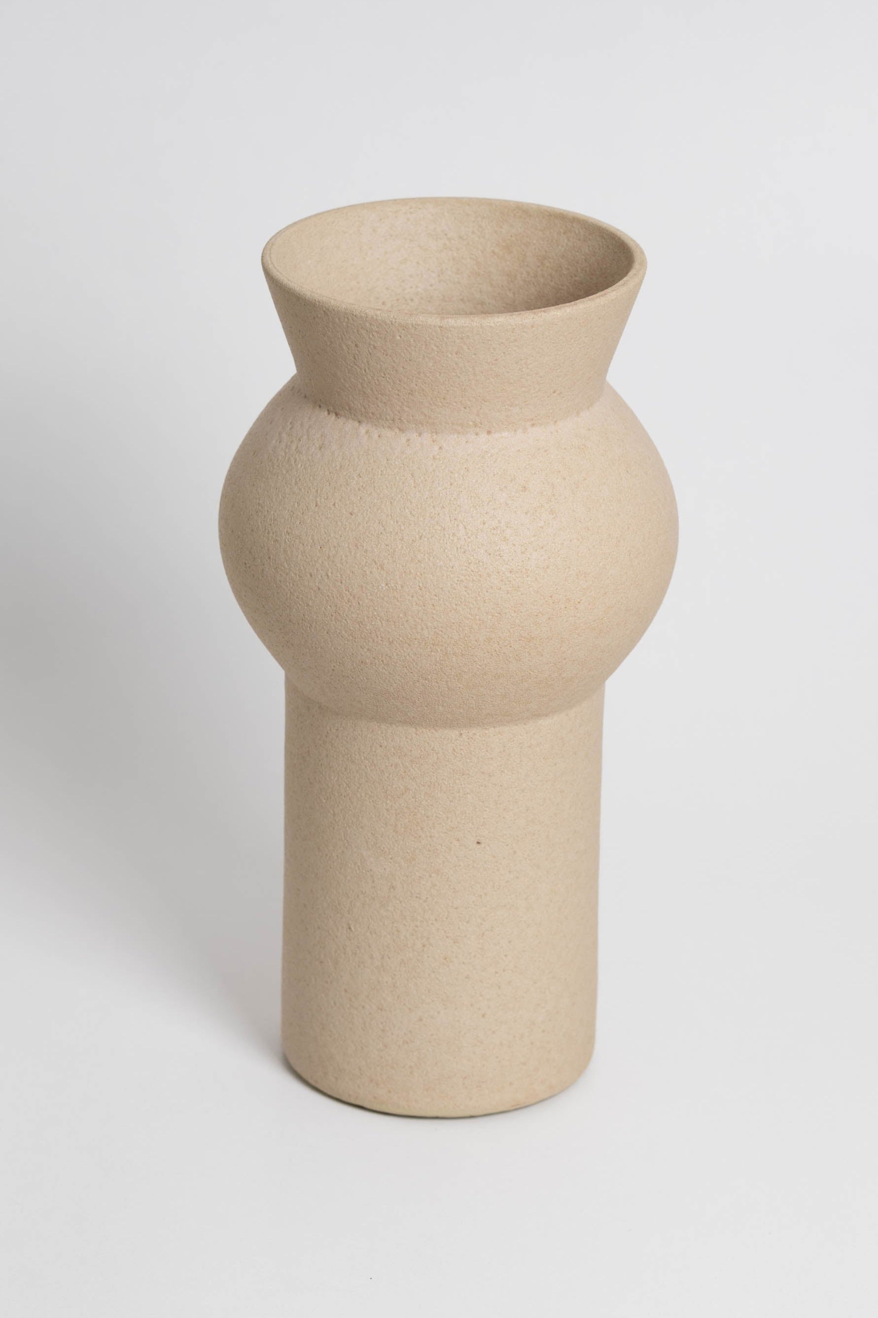 Noachis in cream, ceramic vase with a textured, earthy surface, handmade in Portugal. Perfect for displaying flowers or as a unique decorative vase in modern interiors.