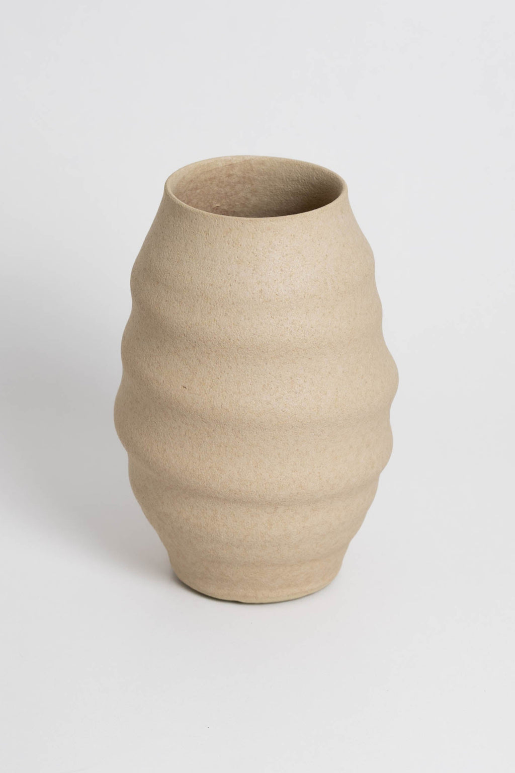 Aonia in cream, decorative vase, minimalist design inspired by the beauty of volcanic textures. It's durable, sustainable and handmade in Portugal.
