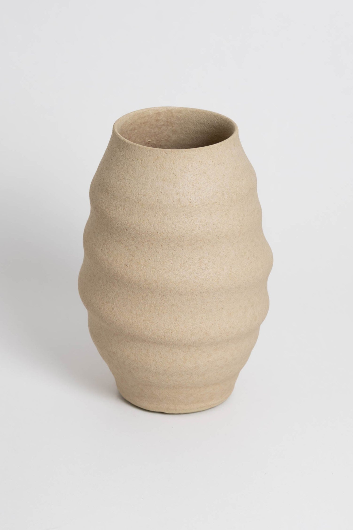 Aonia in cream, decorative vase, minimalist design inspired by the beauty of volcanic textures. It's durable, sustainable and handmade in Portugal.