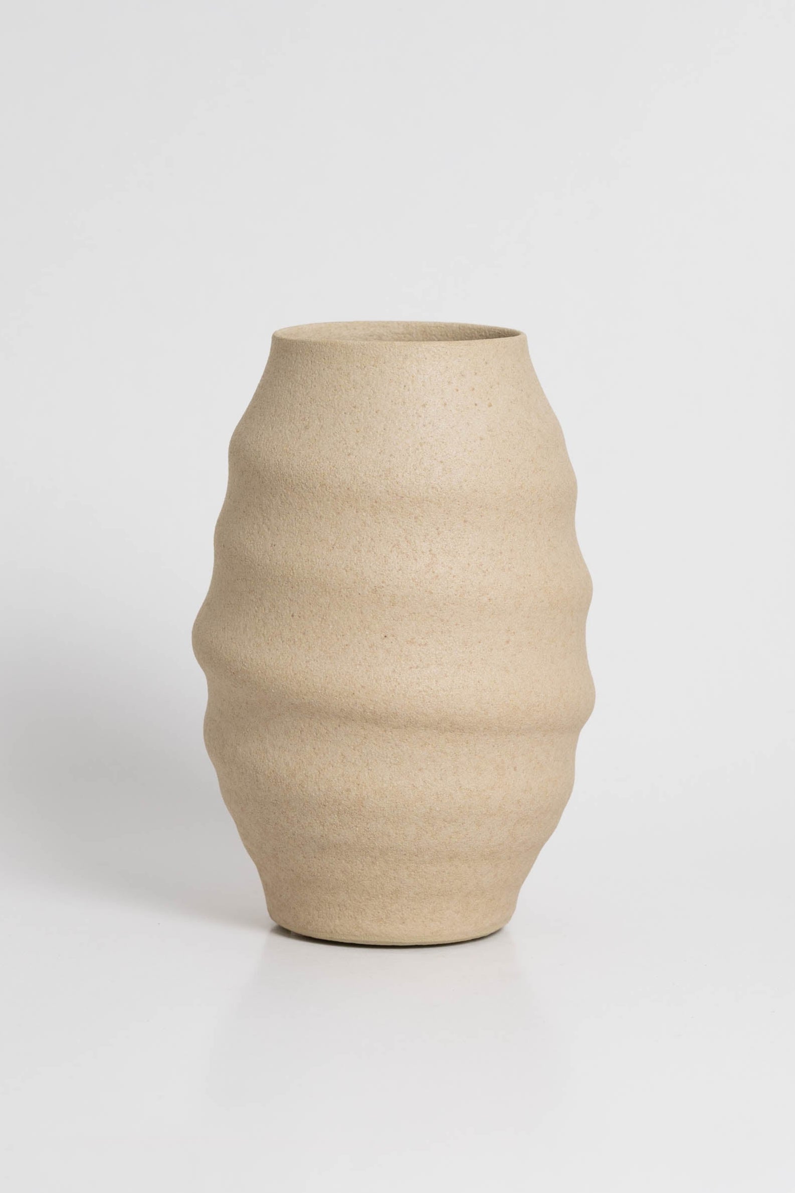 Aonia in cream, decorative vase, minimalist design inspired by the beauty of volcanic textures. It's durable, sustainable and handmade in Portugal.