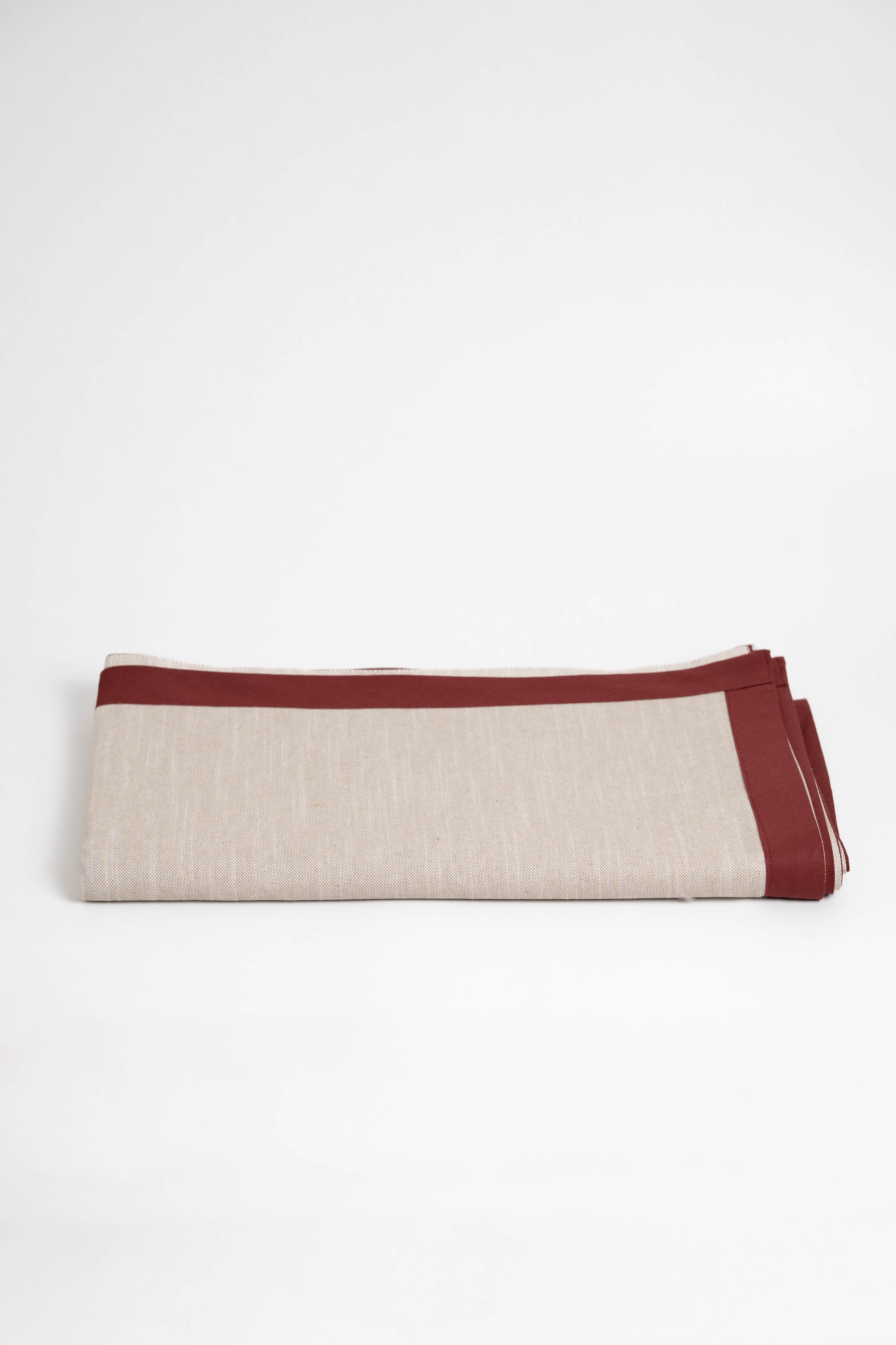 Soft and eco-friendly tablecloth made from cotton, made in Portugal. Features terracotta border detail. Perfect for table decor.