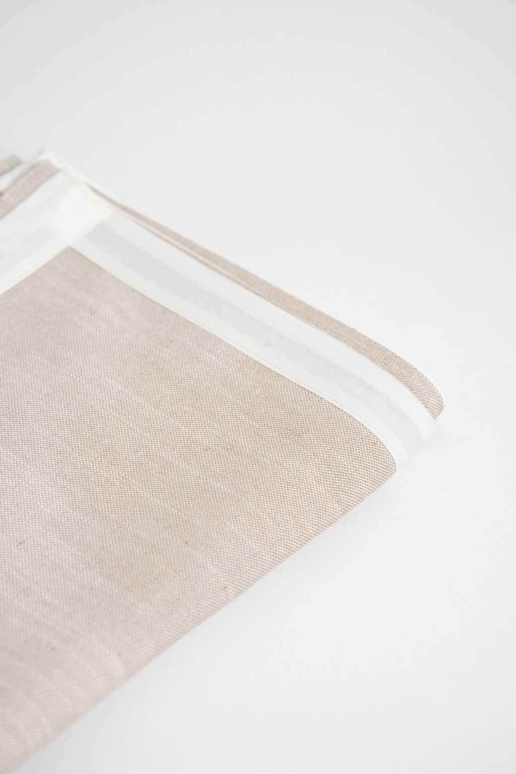 Soft and eco-friendly home textile made from carefully chosen fabrics, made in Portugal to reduce environmental impact. Features white border. Perfect for table decor.