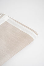 Soft and eco-friendly home textile made from carefully chosen fabrics, made in Portugal to reduce environmental impact. Features white border. Perfect for table decor.