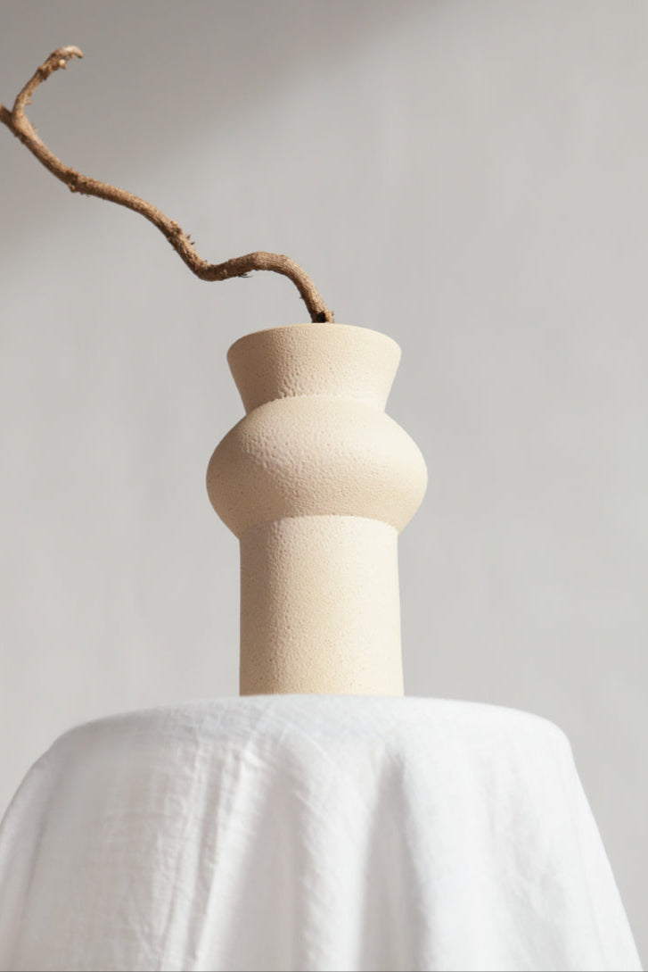 Noachis in cream, ceramic vase with a textured, earthy surface, handmade in Portugal. Perfect for displaying flowers or as a unique decorative vase in modern interiors.