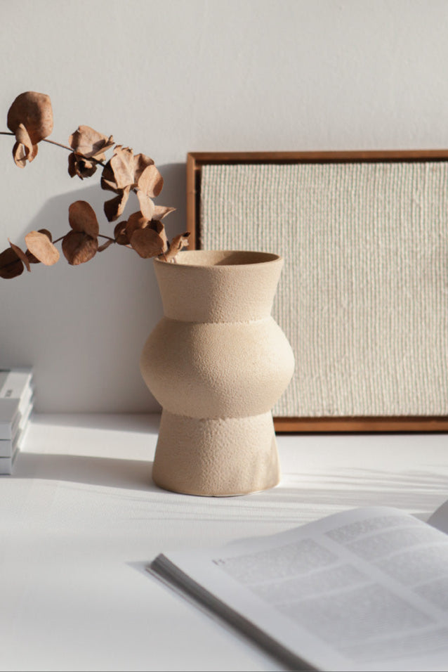Melas in cream, ceramic vase with a textured, earthy surface, handmade in Portugal. Perfect for displaying flowers or as a unique decorative vase in modern interiors.