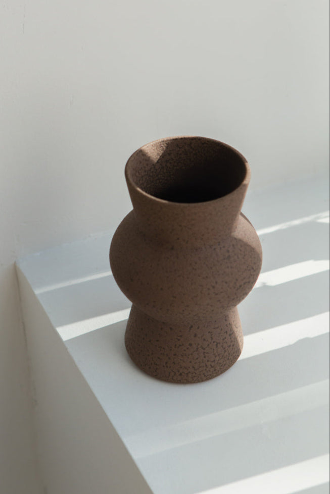 Melas in brown, ceramic vase with a textured, earthy surface, handmade in Portugal. Perfect for displaying flowers or as a unique decorative vase in modern interiors.