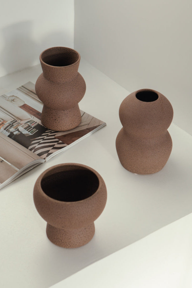 vases in brown, ceramic vase with a textured, earthy surface, handmade in Portugal. Perfect for displaying flowers or as a unique decorative vase in modern interiors.