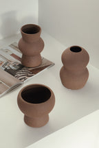 vases in brown, ceramic vase with a textured, earthy surface, handmade in Portugal. Perfect for displaying flowers or as a unique decorative vase in modern interiors.