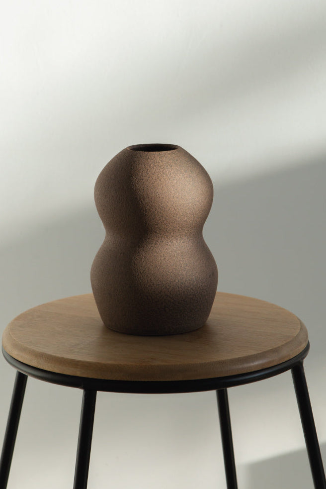 Palus in brown, ceramic vase with a textured, earthy surface, handmade in Portugal. Perfect for displaying flowers or as a unique decorative vase in modern interiors.