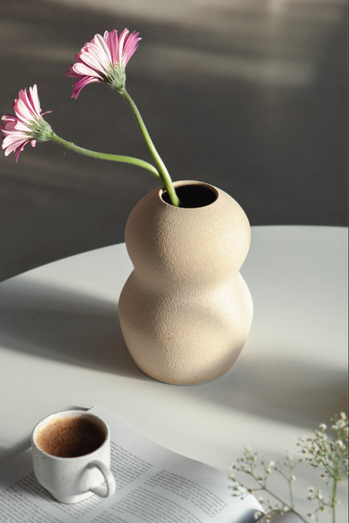 Palus in cream, ceramic vase with a textured, earthy surface, handmade in Portugal. Perfect for displaying flowers or as a unique decorative vase in modern interiors.